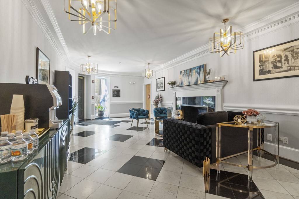 the living room with a fireplace and black and white checkered floor