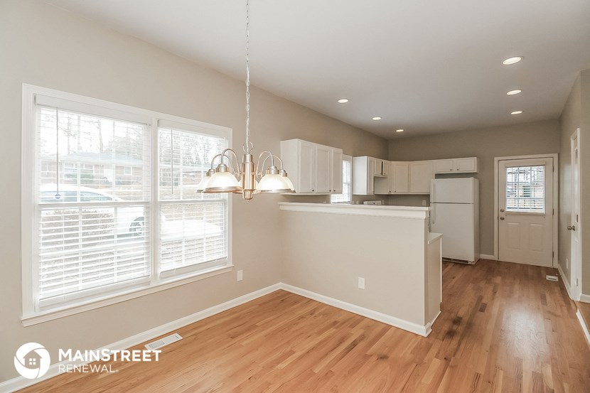 the kitchen is open to the dining room and living room