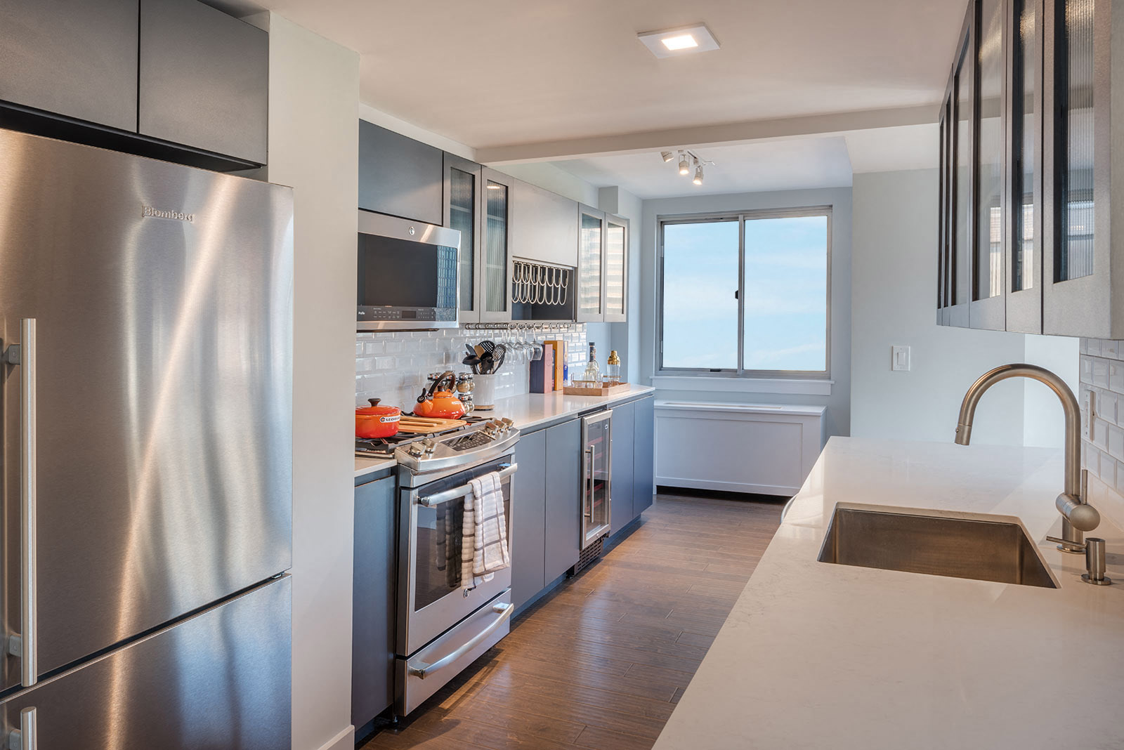 a kitchen with stainless steel appliances and a sink