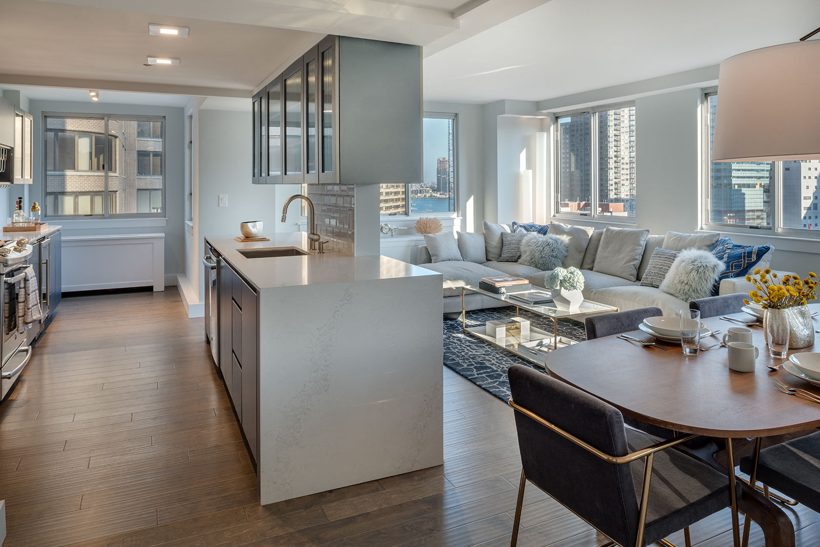 a living room with a kitchen and a dining room