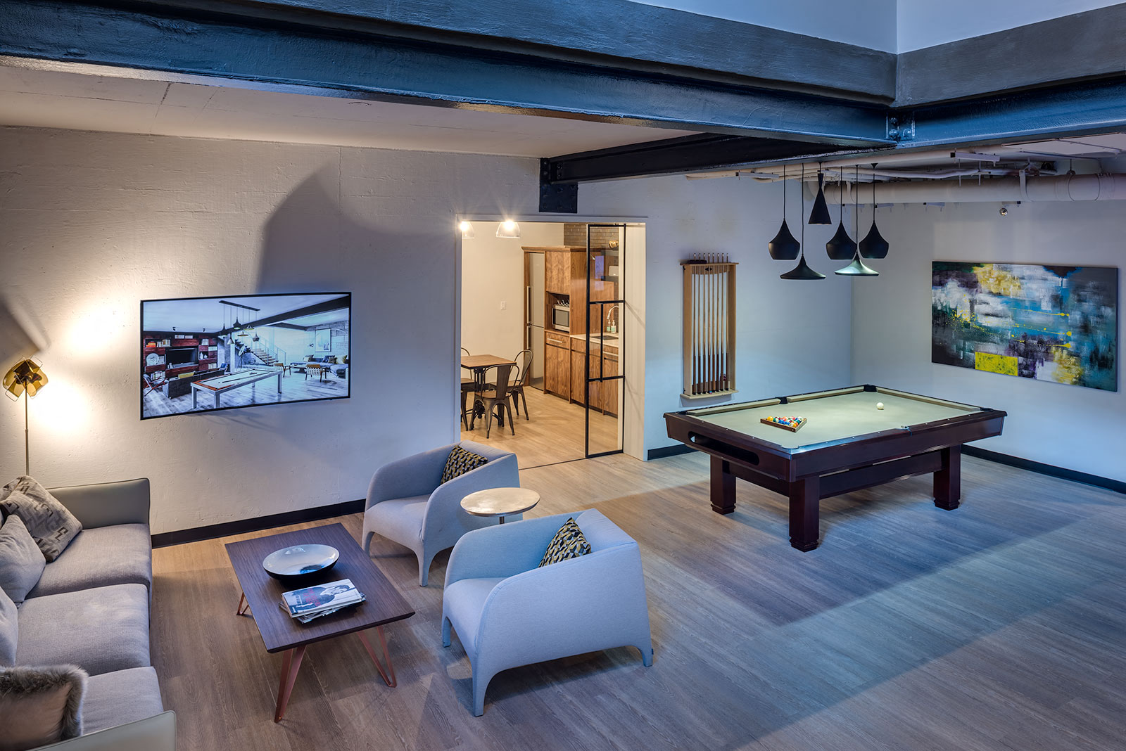 a game room with a pool table and a tv