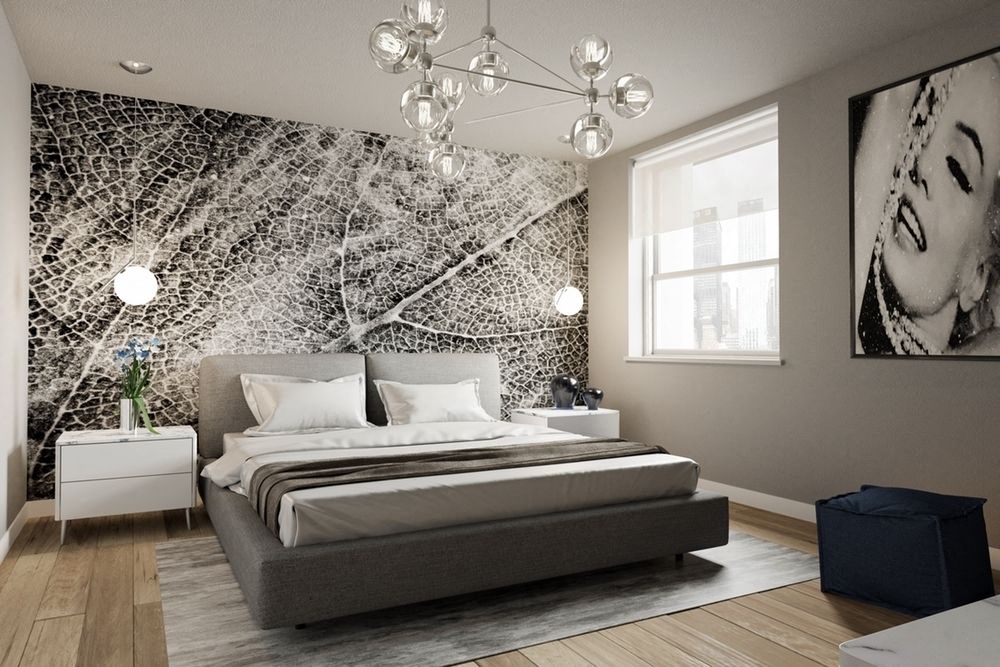 a bedroom with a bed and a mural on the wall