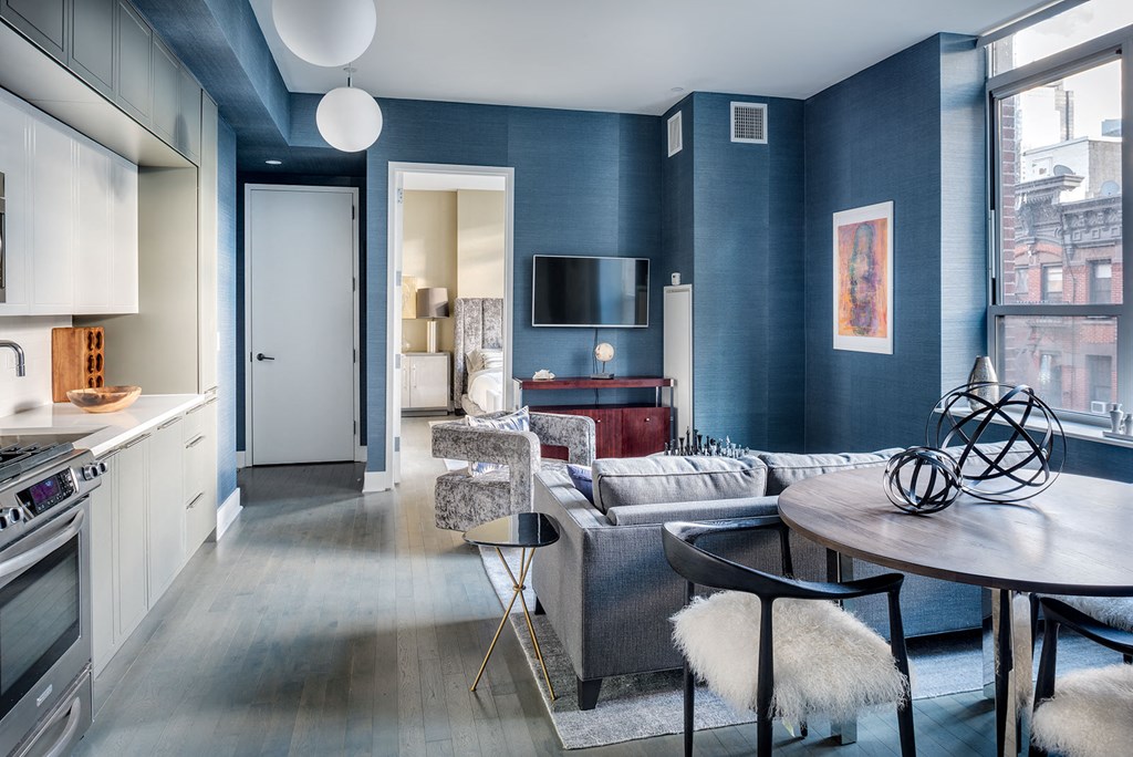 a living room with a couch and a table and a tv