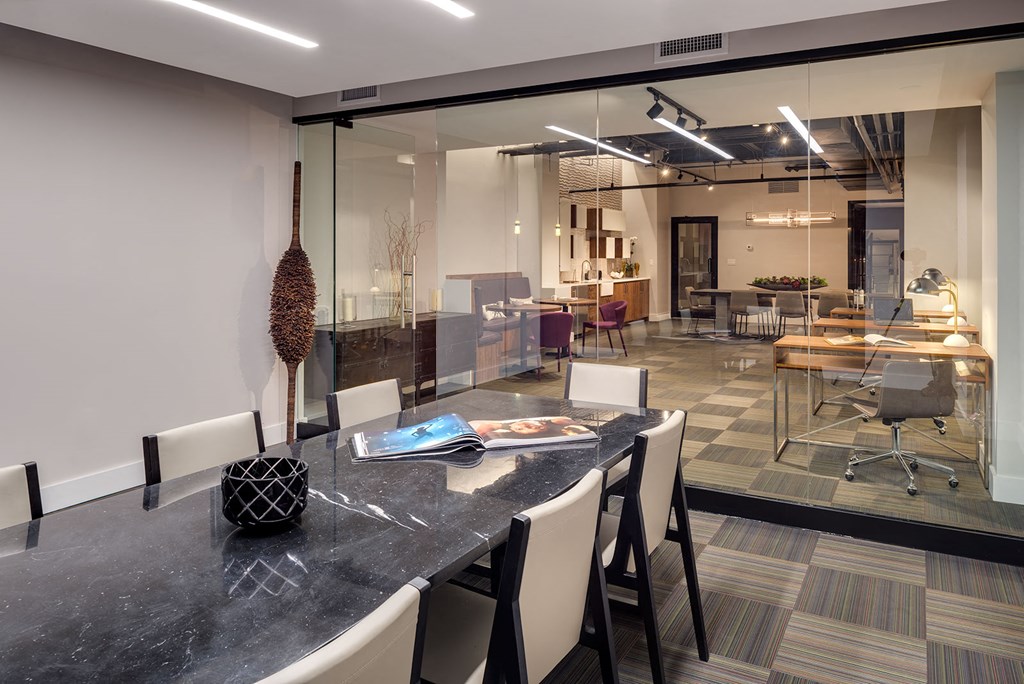 a conference room with a long table and chairs