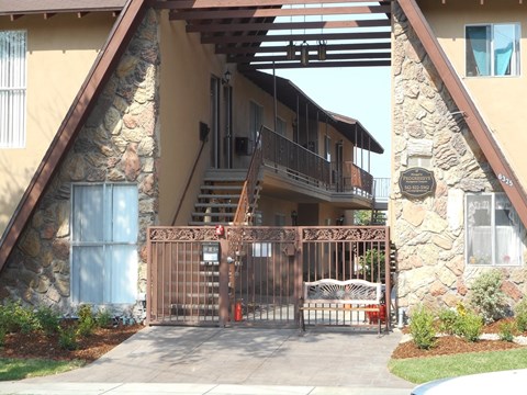 a view of a building with stairs and a gate