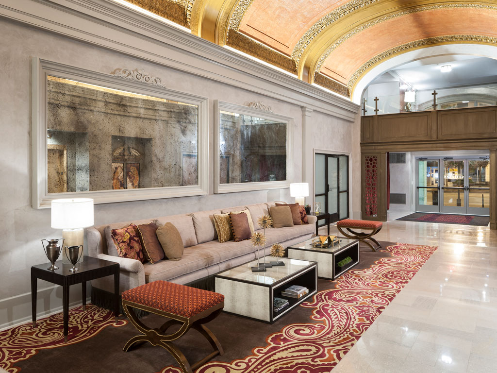 a living room with a couch and a rug