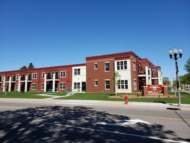 a large brick building on the corner of a street