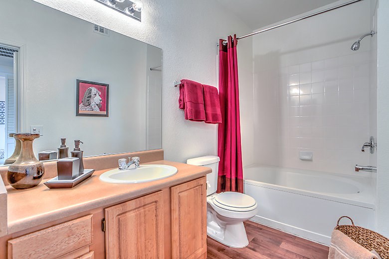 a bathroom with a toilet sink and a bath tub