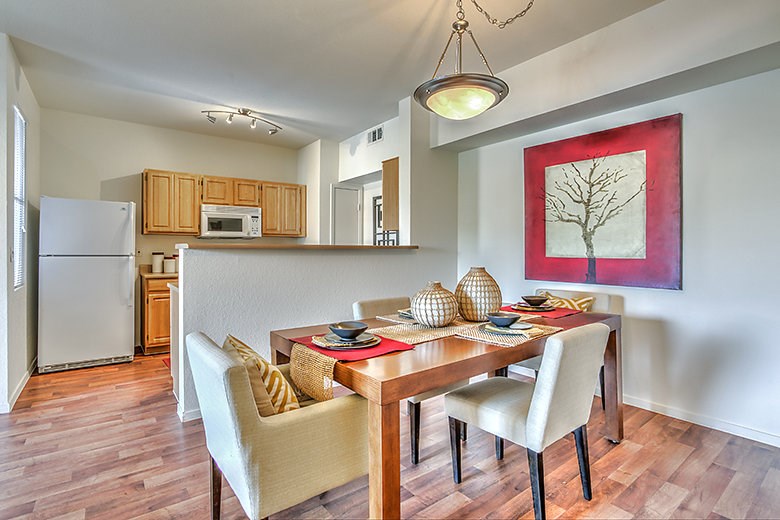 a dining room with a table and chairs