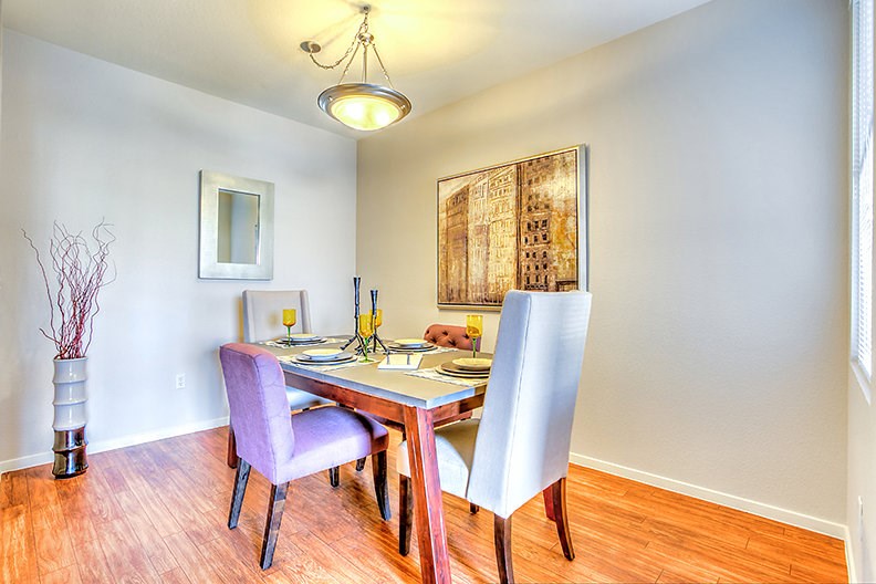a dining room with a table and chairs