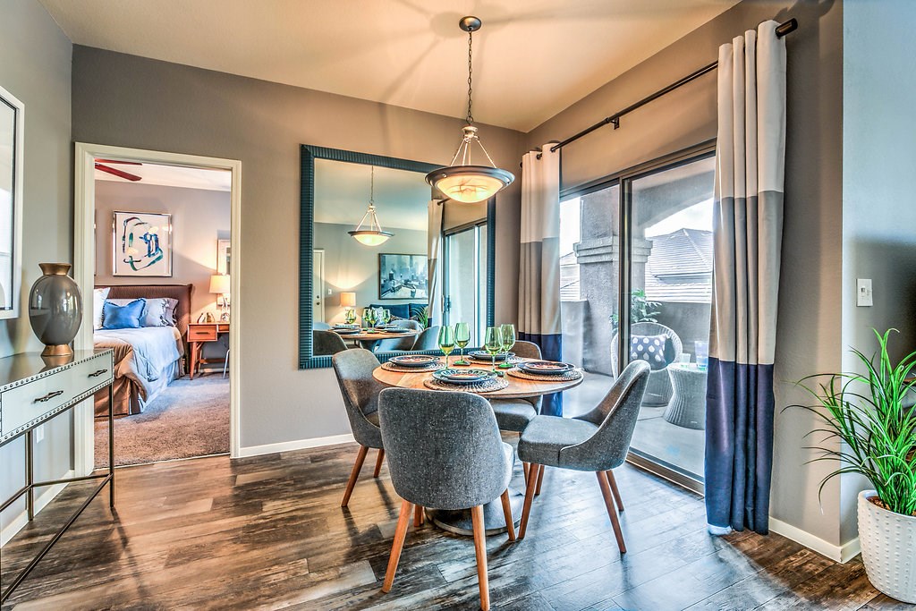 a dining room with a table and chairs