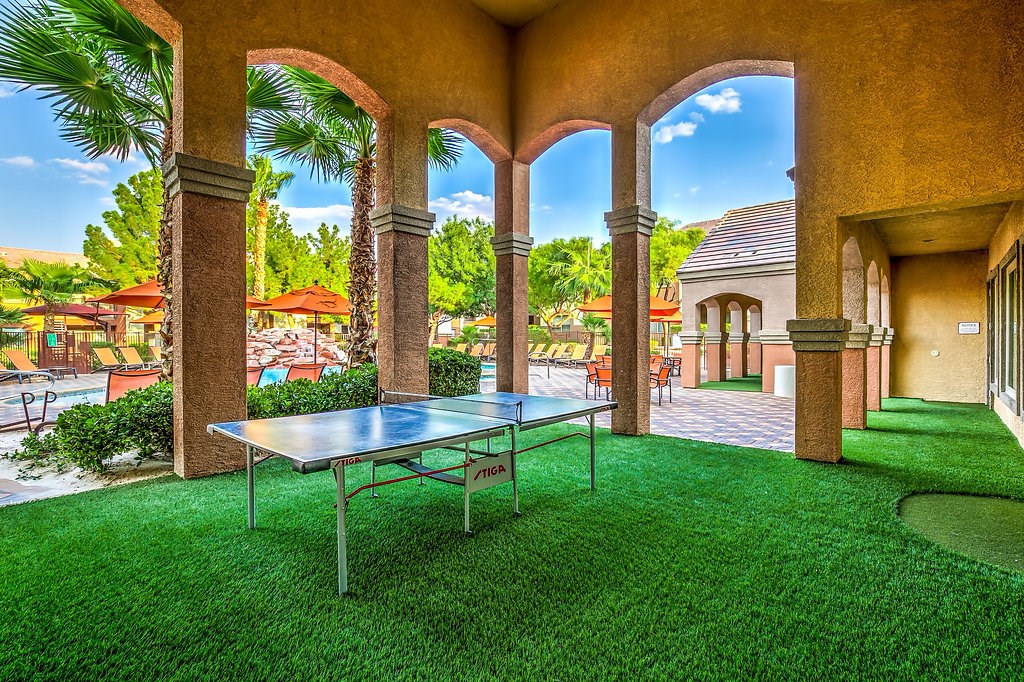 a patio with a ping pong table