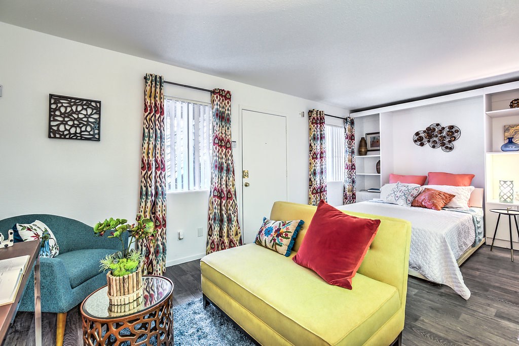 a living room with a couch and a bed