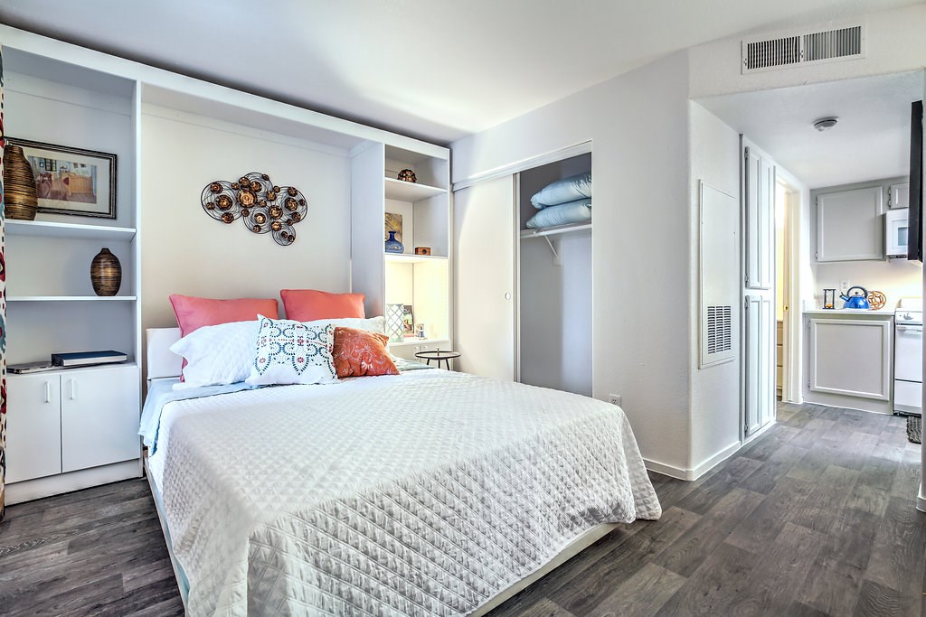 a bedroom with a bed and a closet