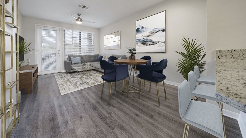 an open living room and dining room with a table and chairs