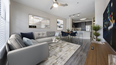 an open living room with a couch and a dining room table