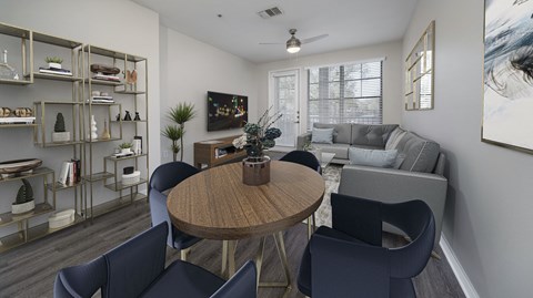 a living room and dining room with a couch and a table