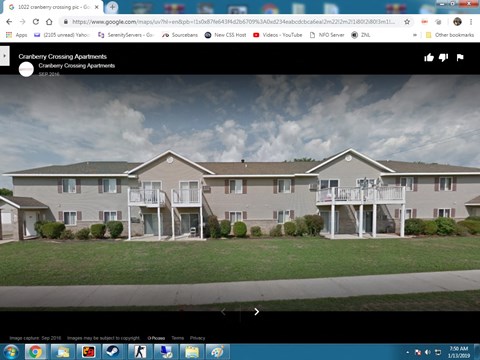 A webpage displays an image of Cranberry Crossing Apartments.