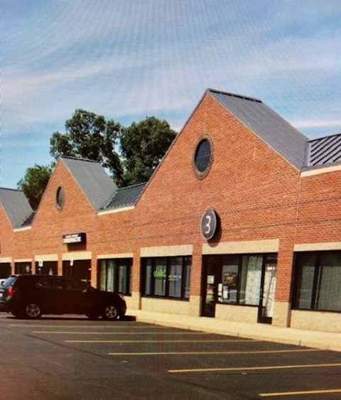 a building with a car parked in front of it