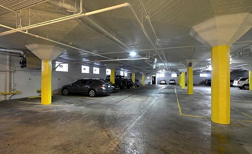 a parking garage with cars parked in it