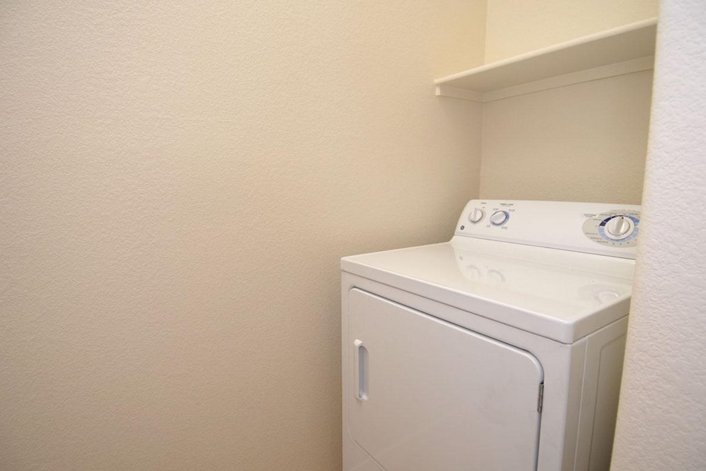 a laundry room with a washer and dryer in it