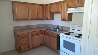 a small kitchen with a stove and a sink