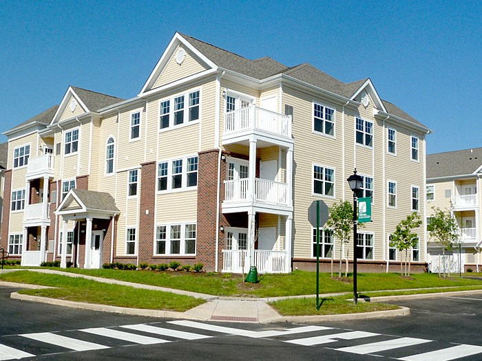 an apartment building on the corner of a street