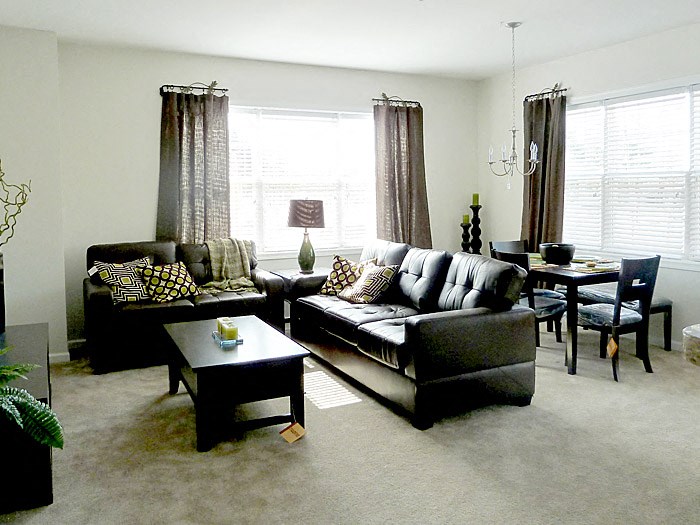 a living room with two couches and a table
