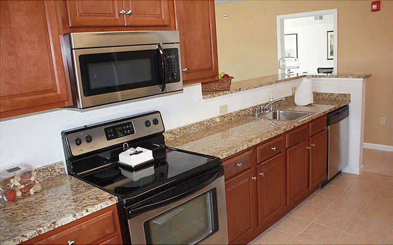 a kitchen with a stove and a microwave