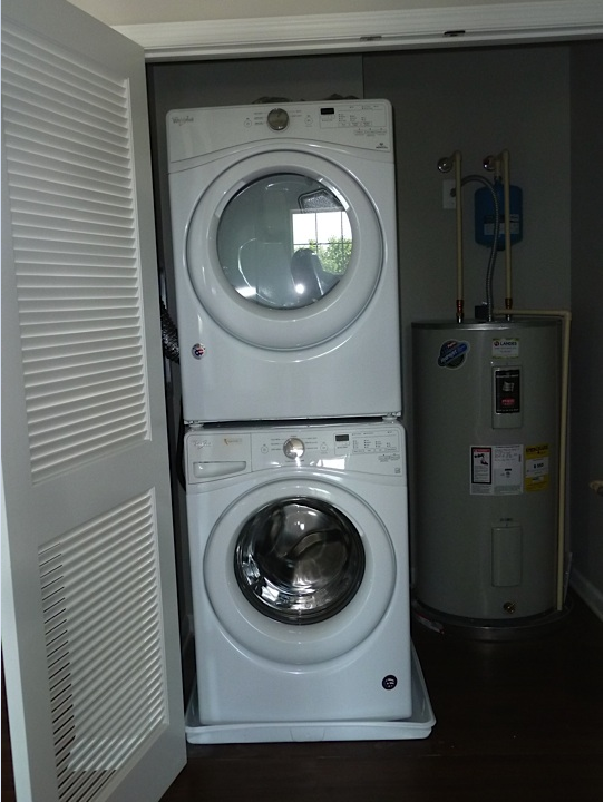 a washing machine and dryer in a small room