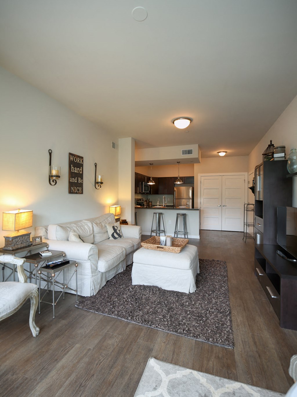 a living room with two couches and a tv