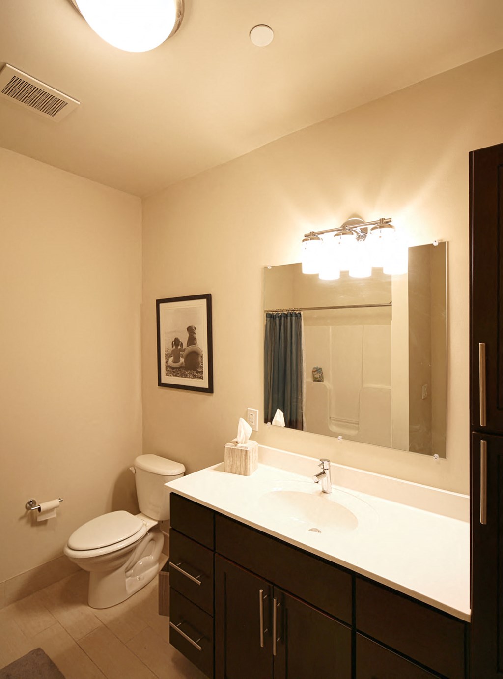 a bathroom with a sink and a toilet and a mirror