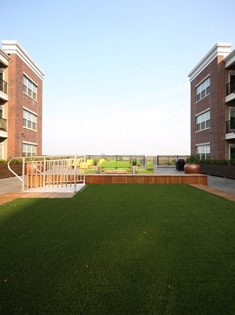 a rendering of a yard in front of an apartment building