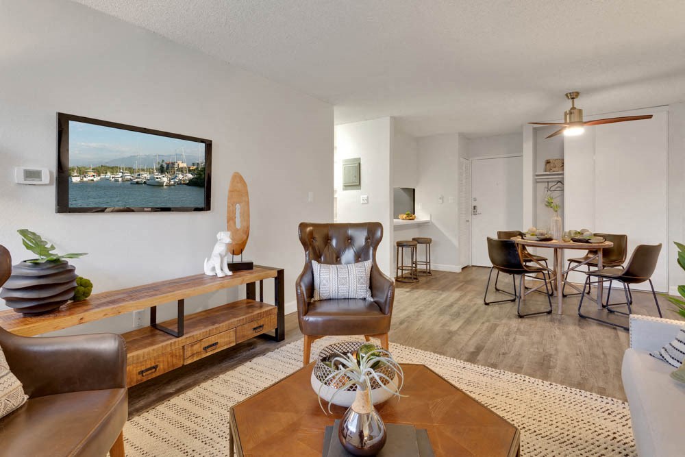 a living room with a couch and a dining room table