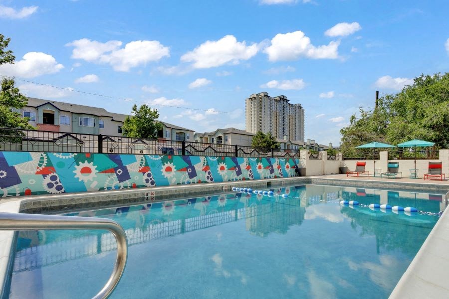 a large swimming pool with a fence around it