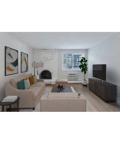 a living room with a couch and a tv