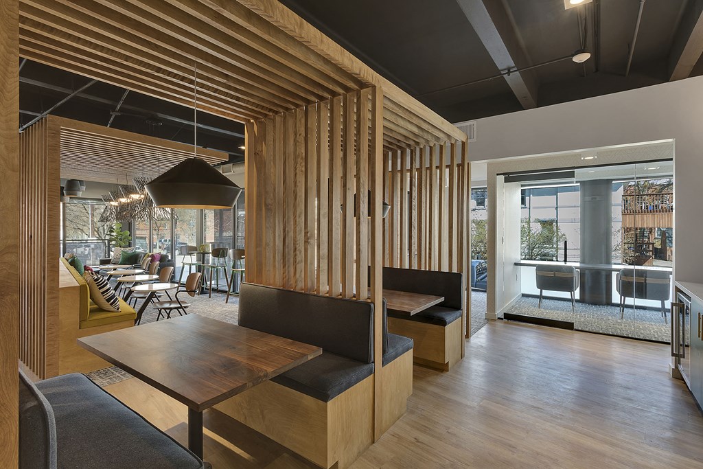 a dining room with wooden tables and chairs and a patio