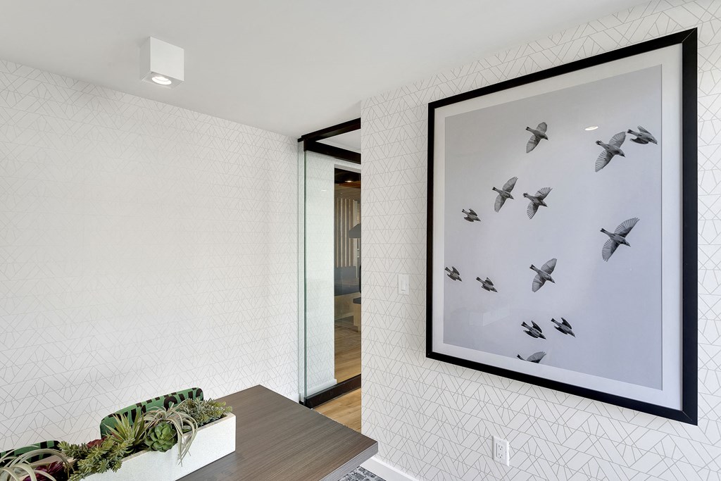 a picture of birds on a wall in a living room
