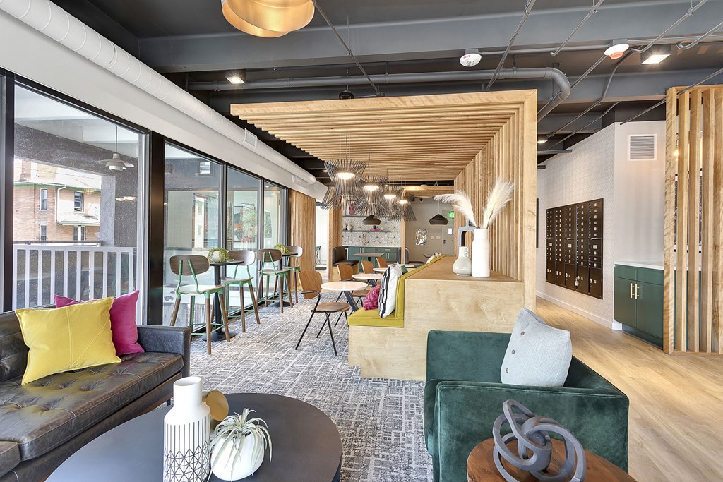 a living room with a couch and a table in a lobby
