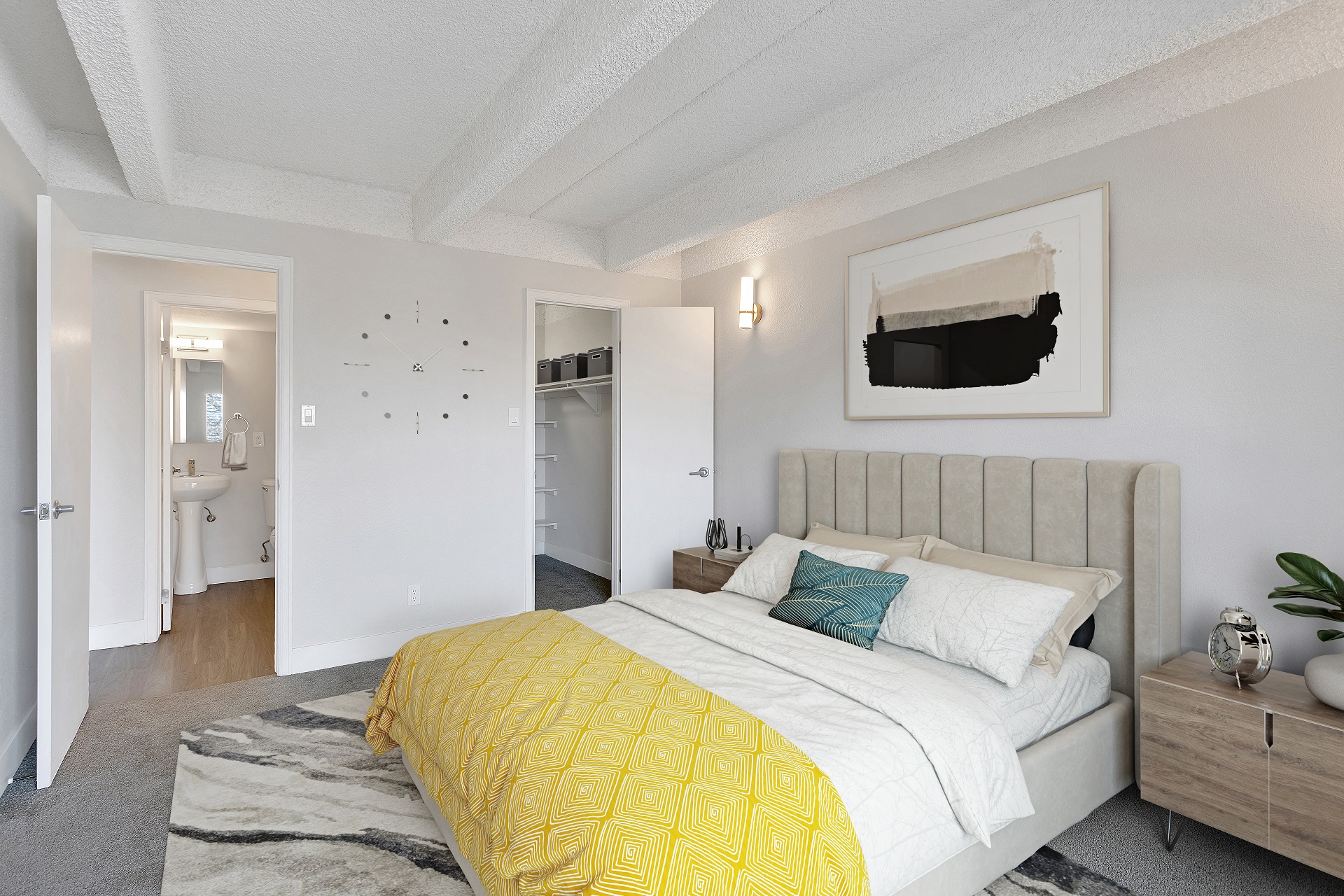 a bedroom with a bed and a yellow comforter