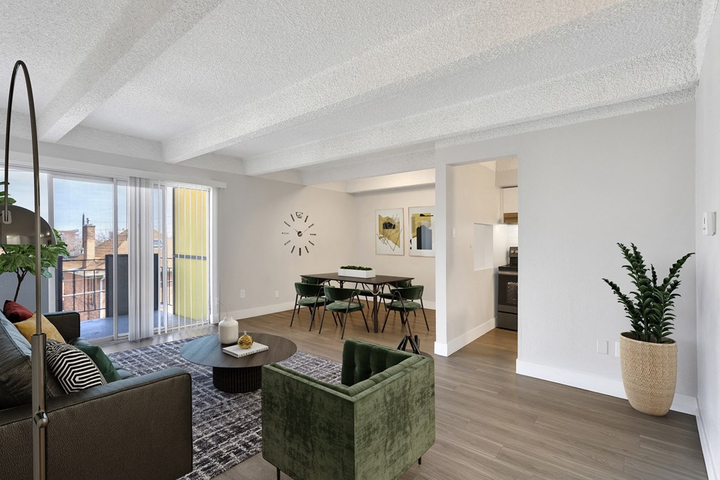 an open living room and dining room with a table and chairs