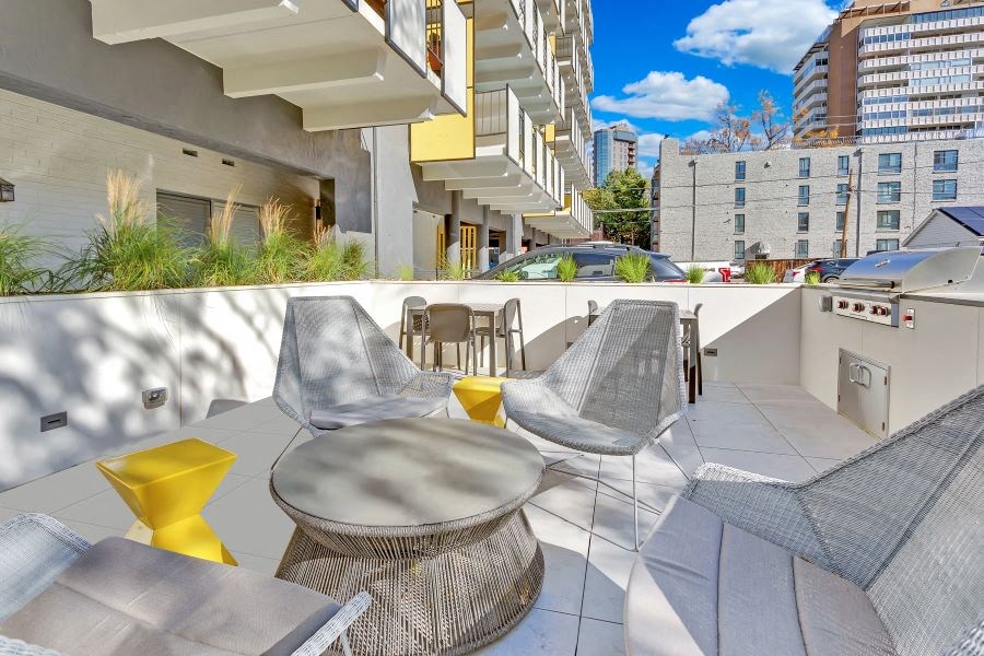 a rendering of a patio with chairs and a table