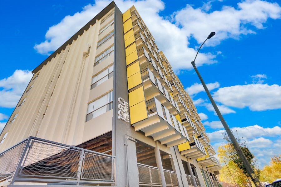 a tall building with a street light in front of it
