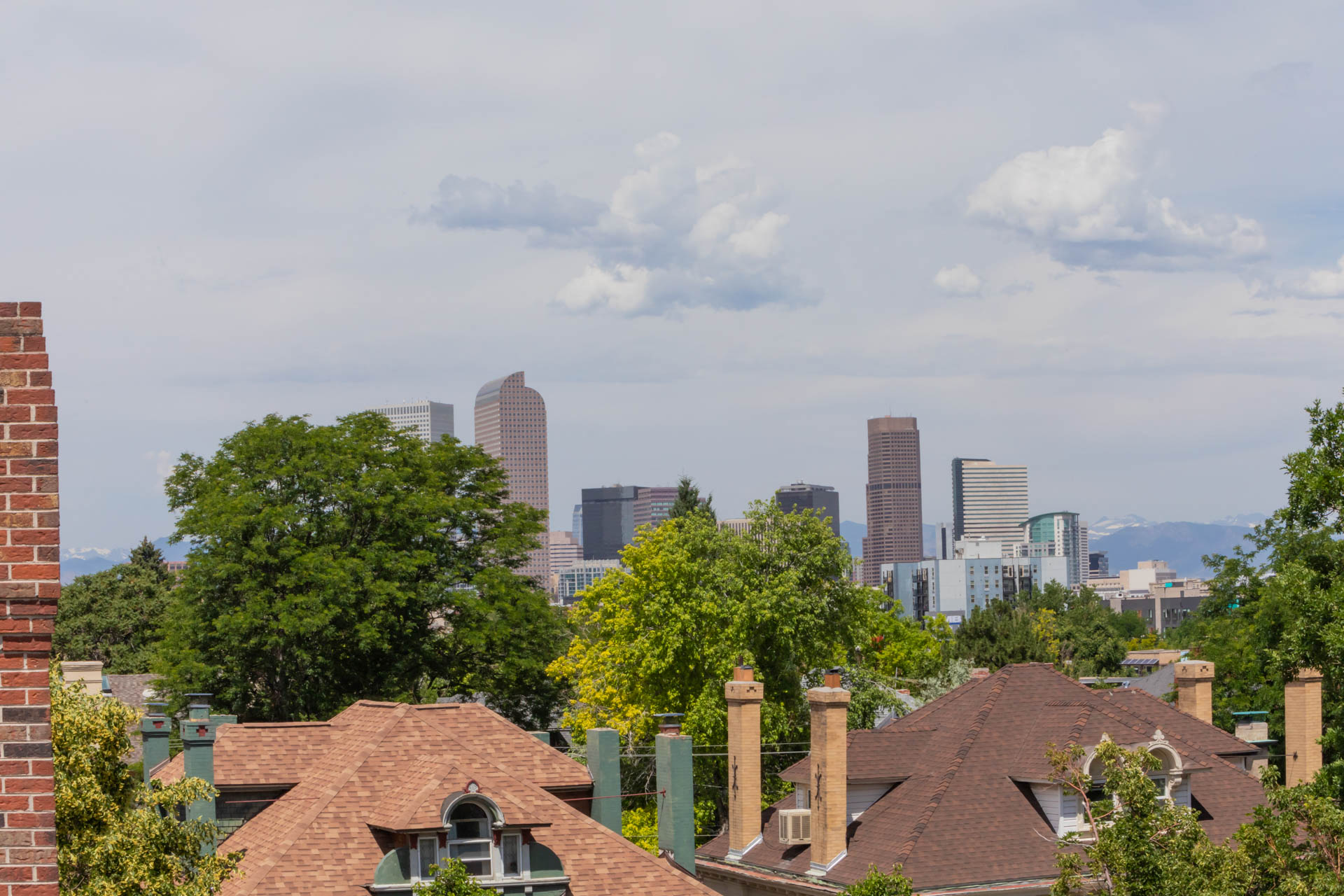 a view of the city skyline from the roof of a house