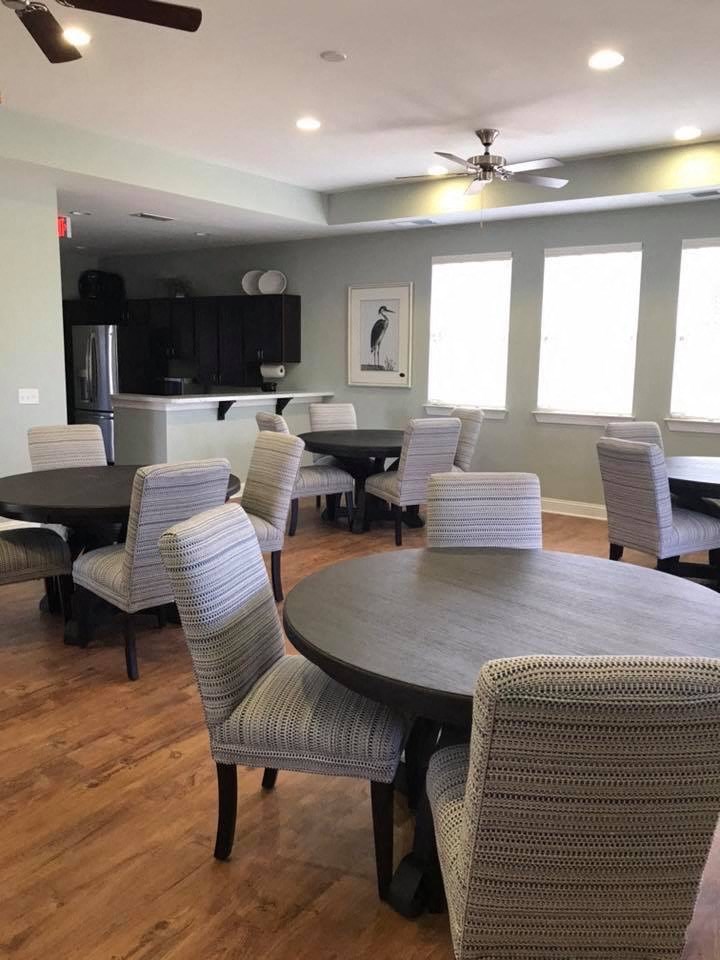 a dining room with a table and chairs