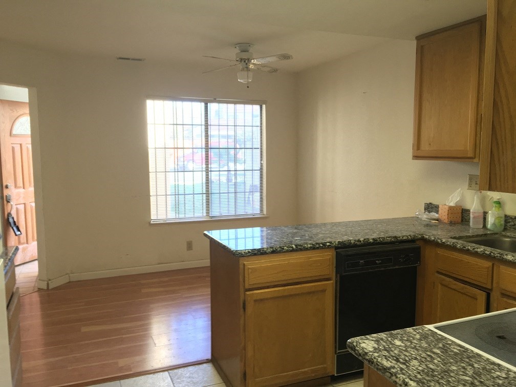 a kitchen with wooden cabinets and a counter top