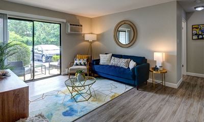 Bright Open Living Room with Wood Flooring - The Clayson