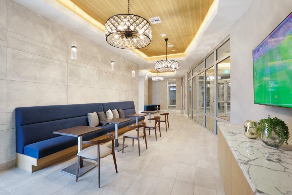 the lobby with tables and chairs