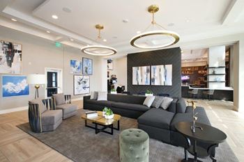 4,000+ square foot club room with full-service kitchen, patio dining and lounging areas