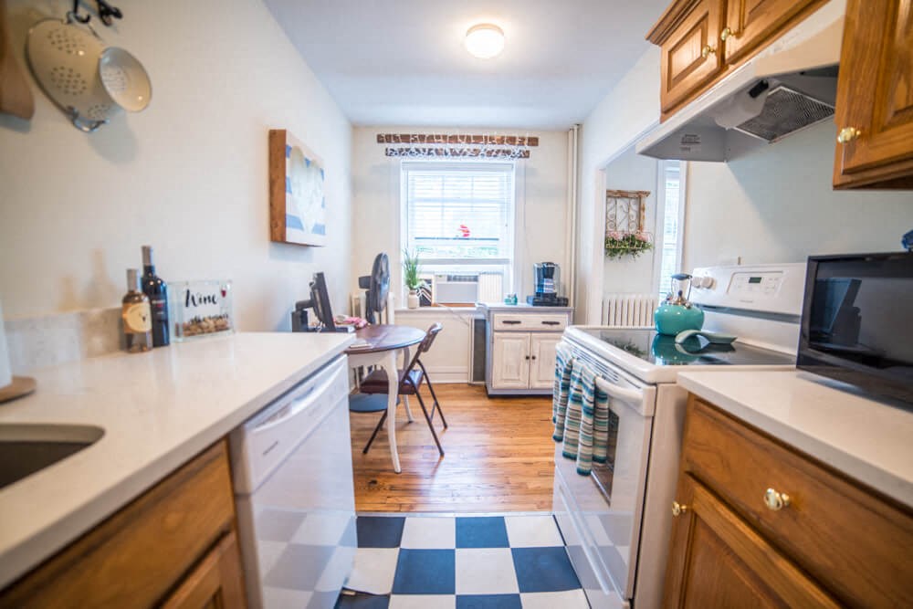 a kitchen with a blue and white checkered floor